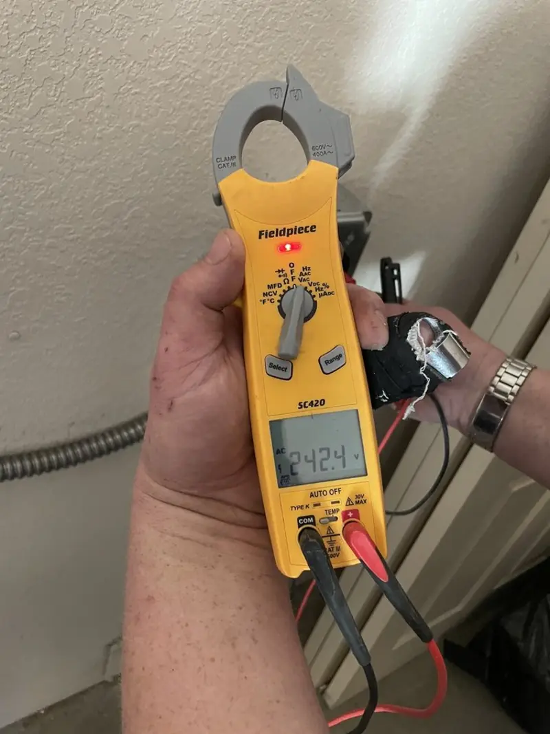 Voltage testing with clamp meter during Ceiling Fan Installation in Fairland